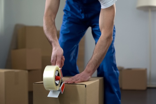 mover doing packing for moving relocation day