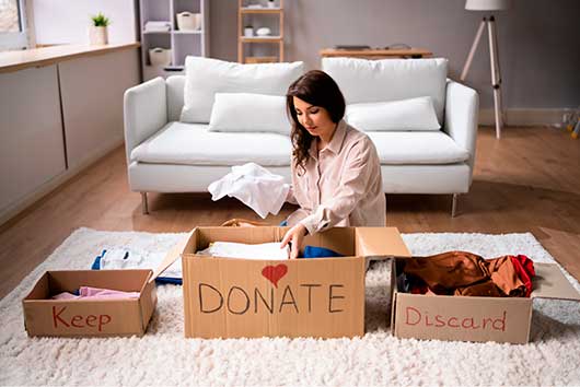 Woman separating donation for moving